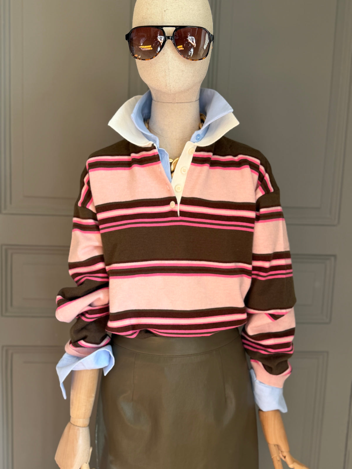 Pink striped knit polo shirt